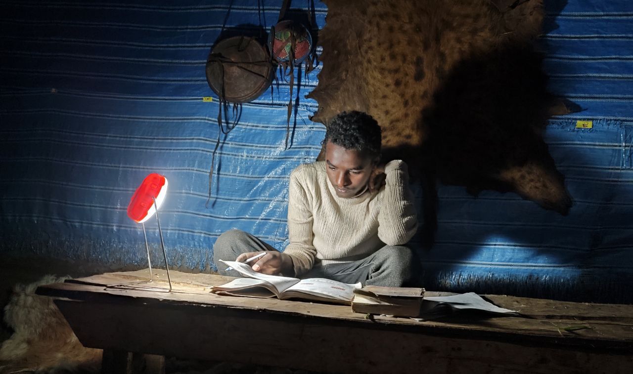Students using solar lighting